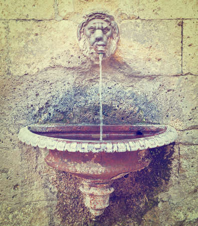 Old Drinking Fountain in Italian Cityの写真素材