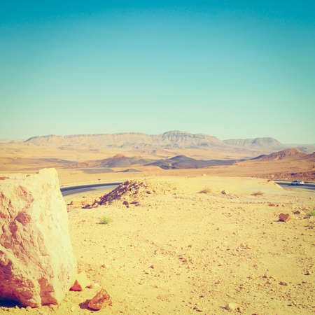 Winding Asphalt Road in the Negev Desert in Israelの写真素材