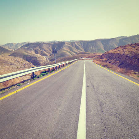 Meandering Road in Sand Hills of Judean Mountains, Israelの写真素材