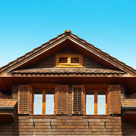 The Windows on the Facade of a Wooden House, Switzerlandのeditorial素材