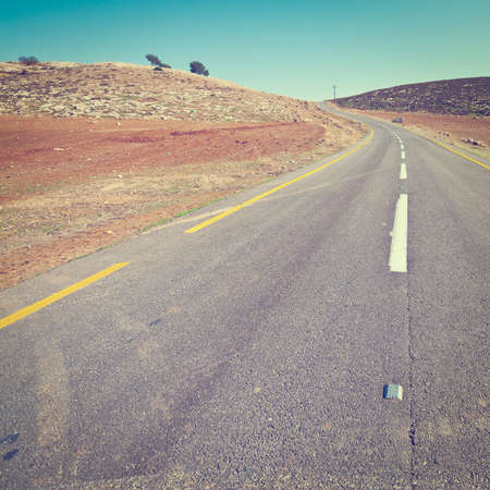 Meandering Road in Sand Hills of Judean Mountain, Israel.の写真素材