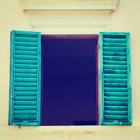 Italian Window with Open Wooden Shutters.の写真素材
