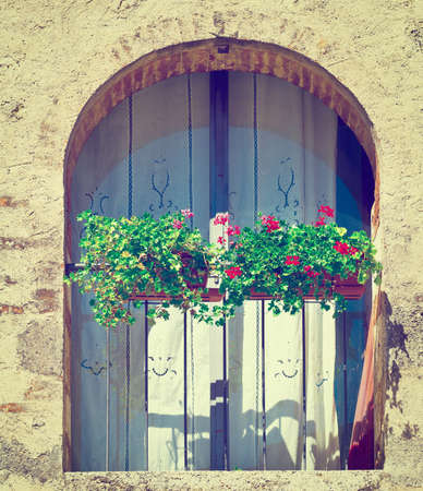 Italian Window  Decorated With Fresh Flowers.の写真素材