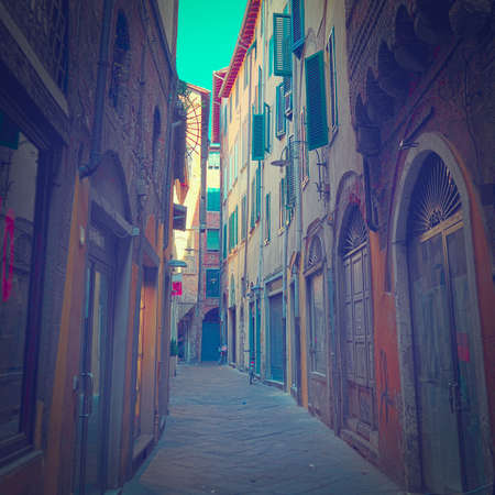 Narrow Alley with Old Buildings in Italian City of  Lucca.の写真素材