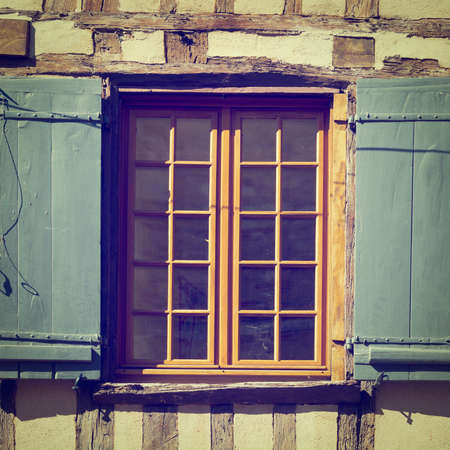 french window with open wooden shutters,の写真素材
