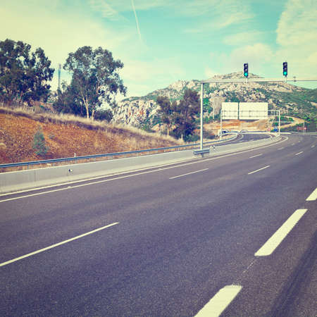 Traffic Lights on the Toll Road Before Entering the Tunnel in Spain,の写真素材