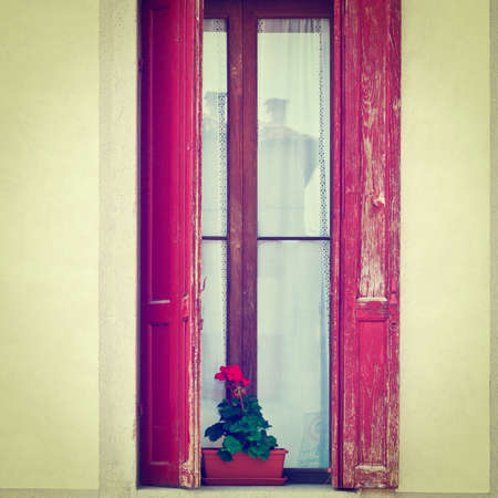 Window on the Facade of the Restored Italian Homeの写真素材