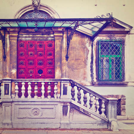 Glass Overhang over the Porch of an Old House in the Italian City of Vicenzaの写真素材