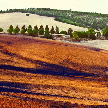 Farmhouse among the Plowed Fields in Spain, Vintage Style Toned Pictureの写真素材