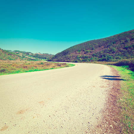 Asphalt Road Leading to the City on the Atlantic Coast of Portugal