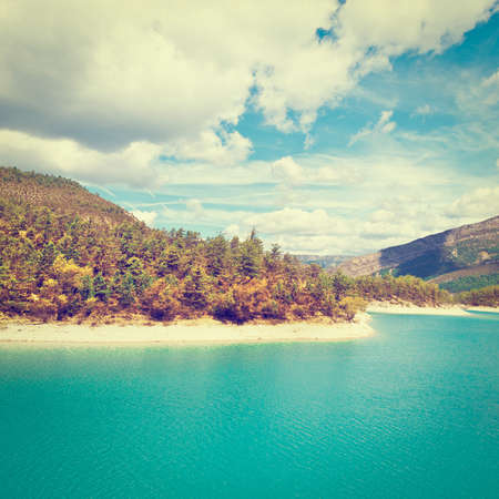 Wooded Shore of the Lake in French Alpsの写真素材