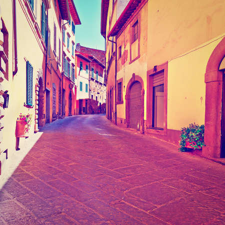 Narrow Alley with Old Buildings in Italian Cityの写真素材