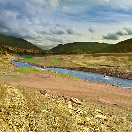 River on the Bottom of Canyon in the Cantabrian Mountainsの写真素材
