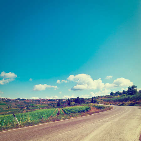 Winding Paved Road in Tuscany, Italy, Vintage Style Toned Pictureの写真素材