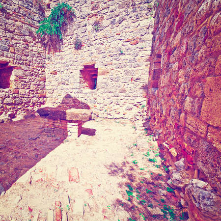 Courtyard of the Fortress in Italian City of Gimignano, Vintage Style Toned Pictureの写真素材