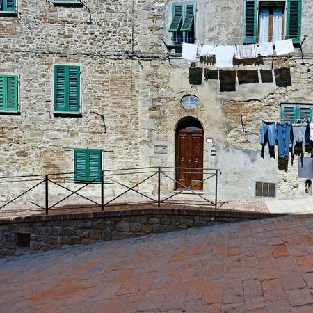 Drying Clothes on the Facade of Italian House, Vintage Style Toned Pictureの写真素材