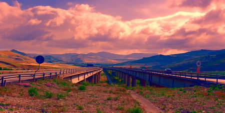 Highway on the Island of Sicily in Italy at Sunsetの写真素材