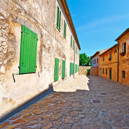 Narrow Street with Old Buildings in Italian Cityの写真素材