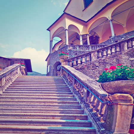 Wide Staircase Leading to the Old Buildings in Italian City in Piedmontの写真素材