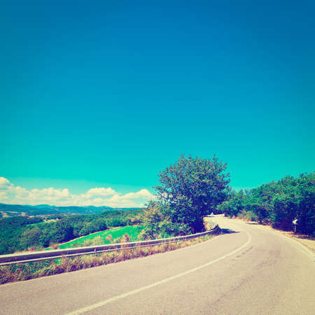 winding paved road in the italian alpsの写真素材