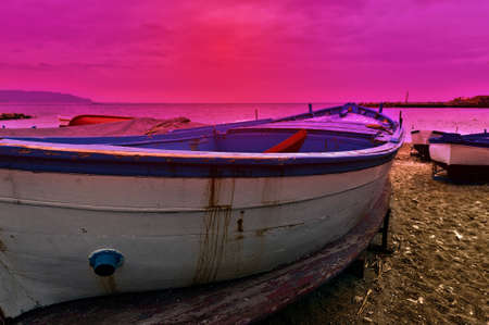 Wooden Boats on the Mediterranean Coast in the Italian City of Cetara at Sunsetの写真素材