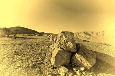 Big Stones of a Desert in Israel at Sunset, Vintage Style Toned Pictureの写真素材
