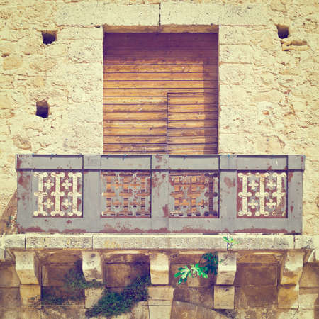 italian balcony in palermo with closed wooden shuttersの写真素材