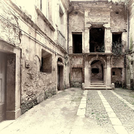 Dilapidated Courtyard of the Old Italian Home in the City of Minori, Vintage Style Toned Pictureの写真素材