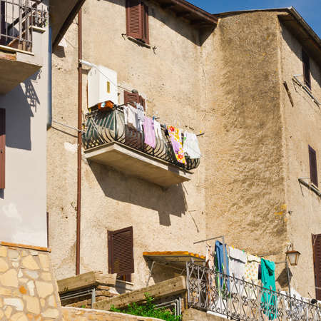 Drying Clothes on the Facade of Italian Houseの写真素材