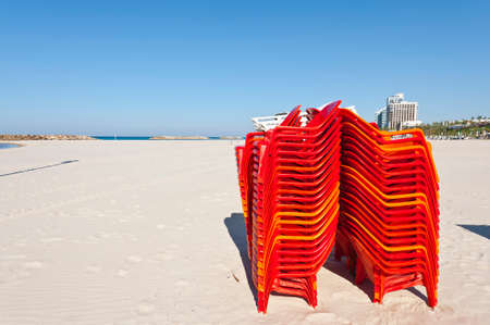 Plastic Chairs on the Beach of Mediterranean Sea in Israelの写真素材