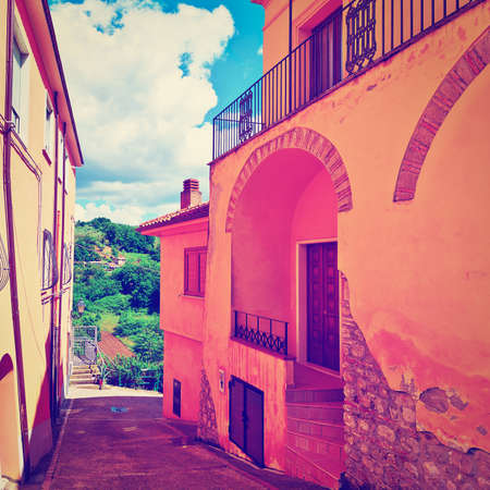 Narrow Street with Old Buildings in Italian Cityの写真素材