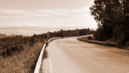 Winding Asphalt Road on Sicily, Vintage Style Sepiaの写真素材