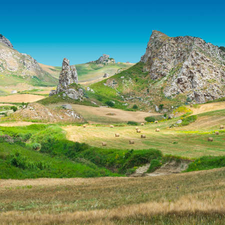 Rocky Landscape of Sicily with Many Hay Balesの写真素材