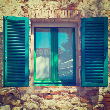 Italian Window with Open Wooden Shuttersの写真素材
