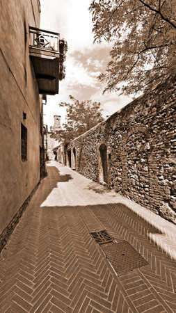 Street in the Medieval City of Gimignano in Italy, Vintage Style Sepiaの写真素材