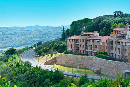 Winding Asphalt Road near the Italian Town