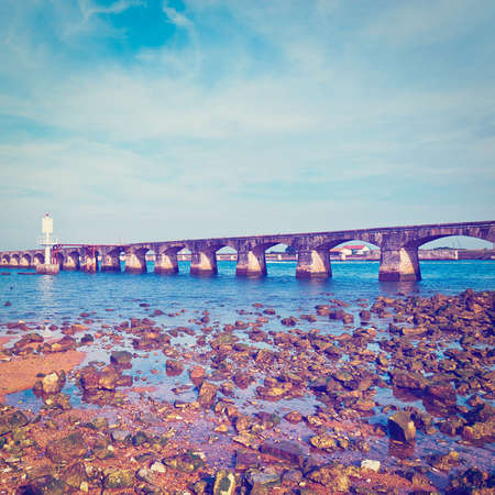 Bridge to Lighthouse on the Atlantic Coast of France