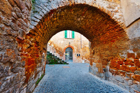 Old Arch in Italian Medieval Cityの写真素材
