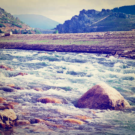 River and Dam on the Bottom of Canyon in the Cantabrian Mountainsの写真素材