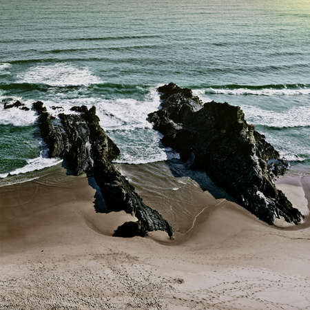 Rocky Coast of Atlantic Ocean in Portugal at Sunset, Vintage Style Toned Pictureの写真素材