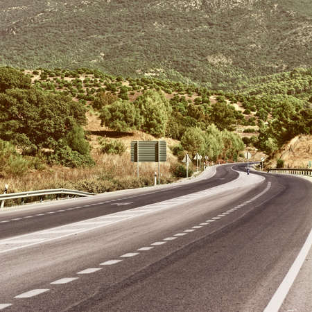 Winding Paved Road in the Cantabrian Mountain, Spain, Vintage Style Toned Pictureの写真素材