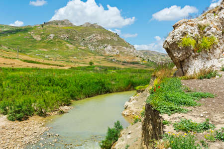 Mountain Stream between Volcanic Hills of Sicily