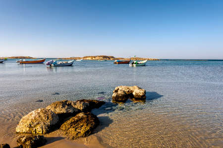 Small motor boats at the beach.  Fishing Boats moored in the mediterranean sea in Israelの写真素材