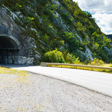 Tunnel in the Rock on the Road  High Up in the French Alpsの写真素材