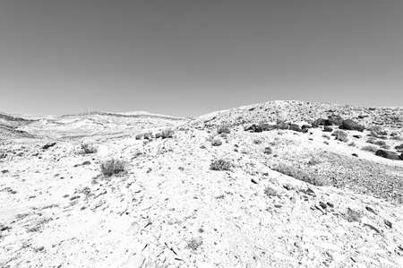 rocky hills of the negev desert in israel wind carved rock formations in the southern israel desert black and white pictureの写真素材