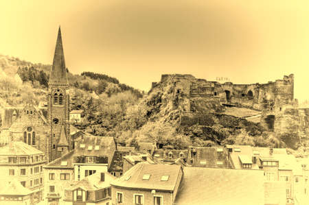 View of the Church and the Castle in the Belgian City of La Roche. View of the town centre below its medieval Castle in of La Roche. Vintage Style Toned Pictureのeditorial素材