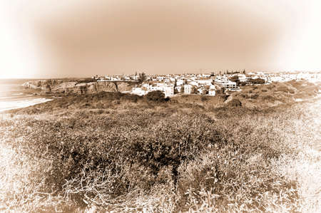 city on the rocky coast of atlantic ocean in portugal stylized photoの写真素材