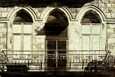 Windows of traditional stoned house in old Acre. Arab architecture of the old city of Akko in Israel. Vintage style toned pictureの写真素材