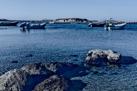 Small motor boats at the beach.  Fishing Boats moored in the mediterranean sea in Israel at Night.の写真素材