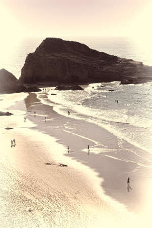 Sandy Beach on the Rocky Coast of Atlantic Ocean in Portugal at Sunset, Stylized Photoの写真素材